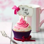 Cupcake with "Eat Me" pick